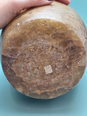 Lot 259 - A banded brown alabaster vase, the ovoid body...