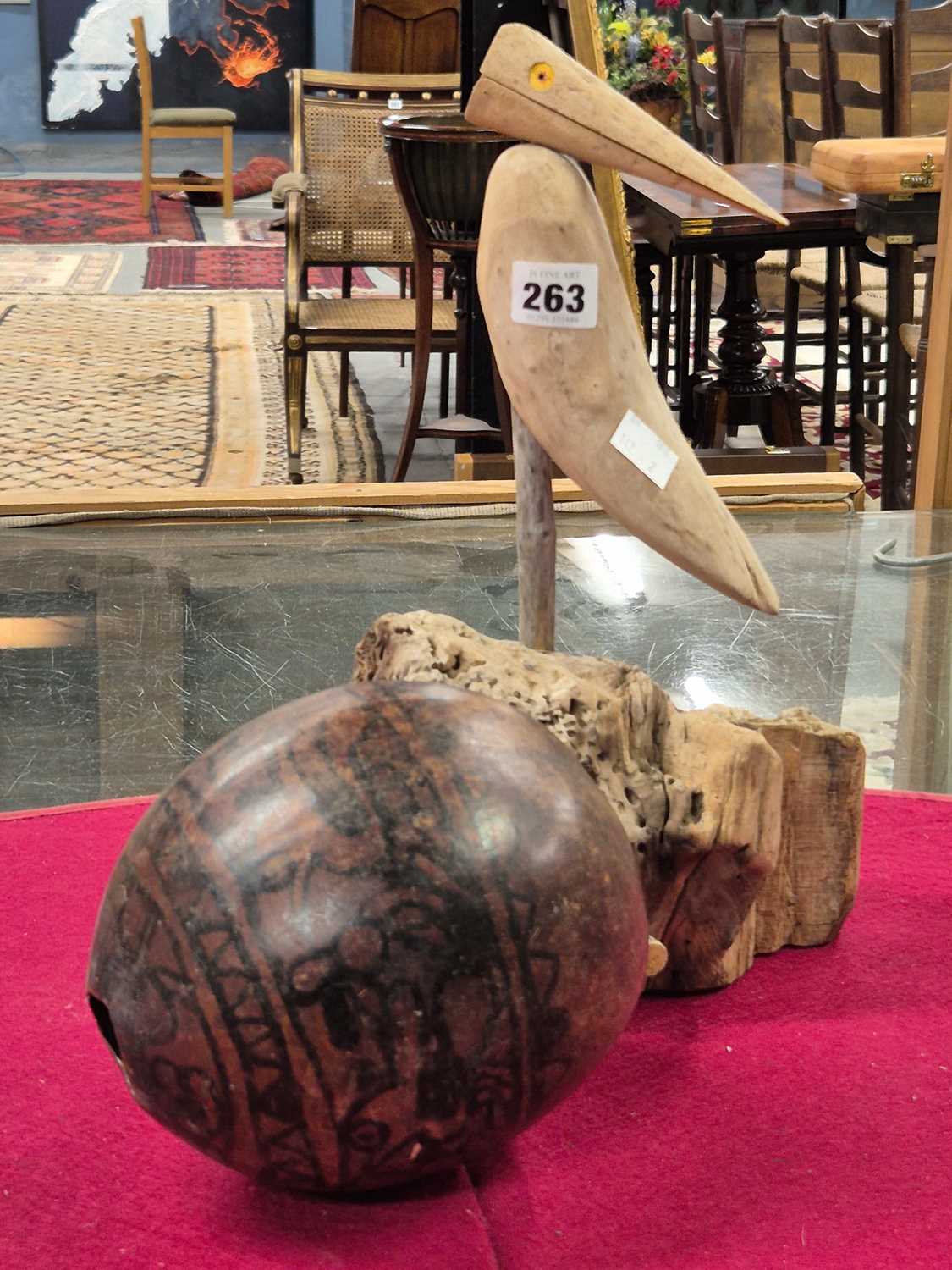 Lot 263 - A Guatemalan tribal gourd painted in black...