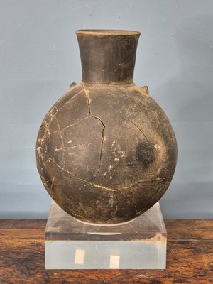 Lot 264 - A Chimu grey pottery flattened ovoid vase...