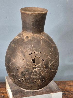 Lot 264 - A Chimu grey pottery flattened ovoid vase...