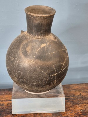 Lot 264 - A Chimu grey pottery flattened ovoid vase...