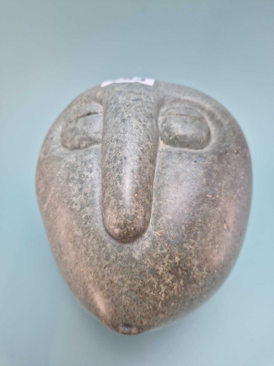 Lot 294 - A Shona green stone head carved by Fanizani...