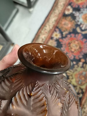 Lot 299 - A Lalique deep amber Feuilles Votive pattern...