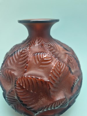 Lot 299 - A Lalique deep amber Feuilles Votive pattern...