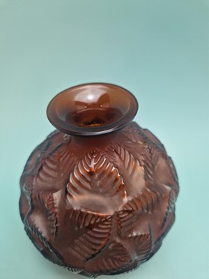 Lot 299 - A Lalique deep amber Feuilles Votive pattern...