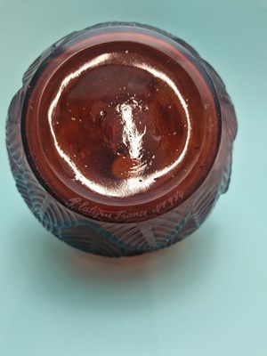 Lot 299 - A Lalique deep amber Feuilles Votive pattern...