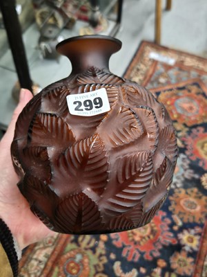 Lot 299 - A Lalique deep amber Feuilles Votive pattern...