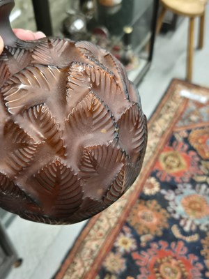 Lot 299 - A Lalique deep amber Feuilles Votive pattern...