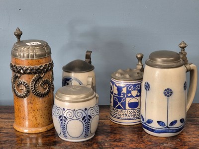 Lot 310 - Five various pewter lidded steins of which...