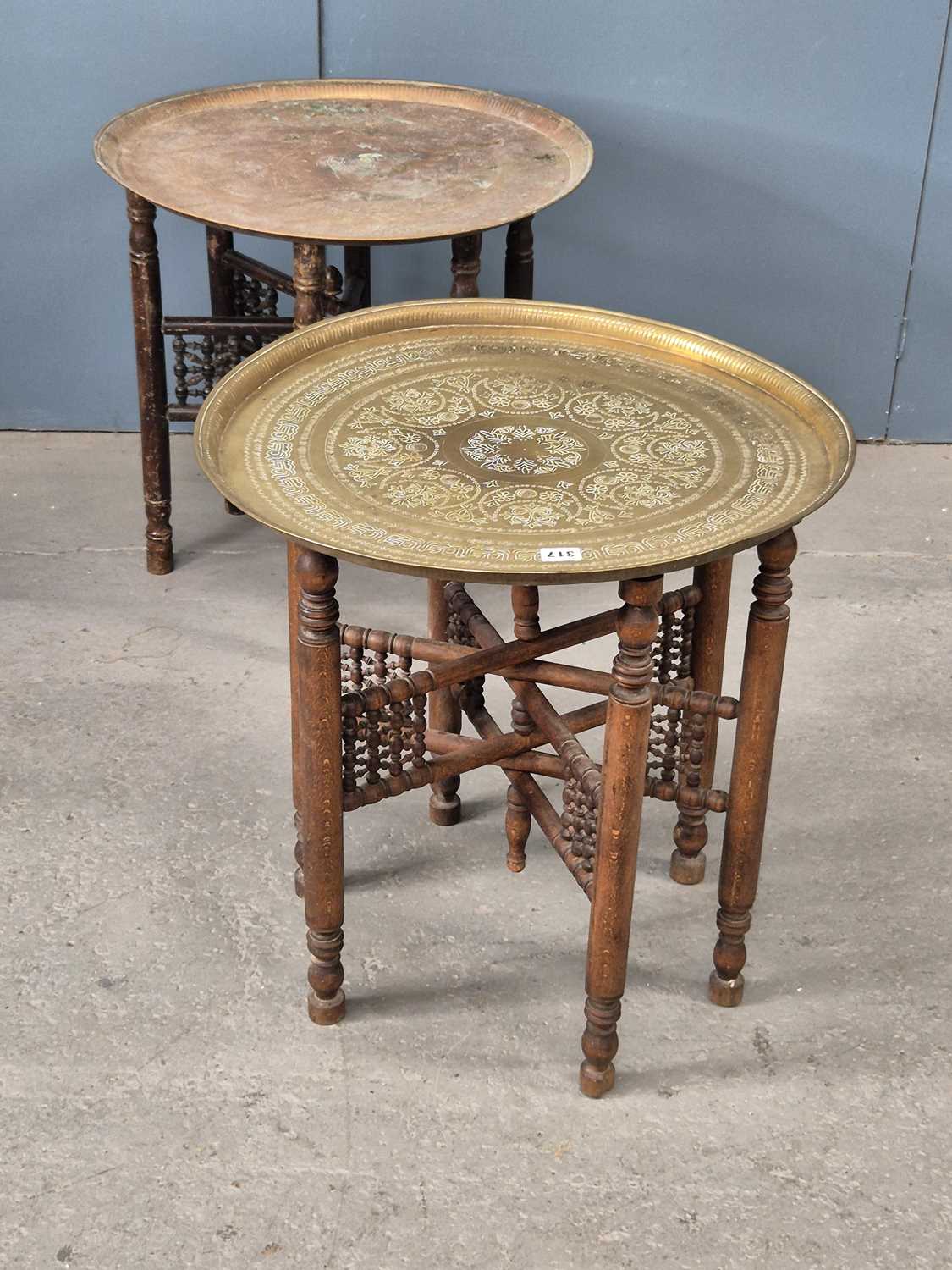 Lot 317 - Two similar brass trays with their wooden six...