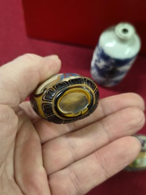 Lot 335 - Three Chinese snuff bottles, one of interior...