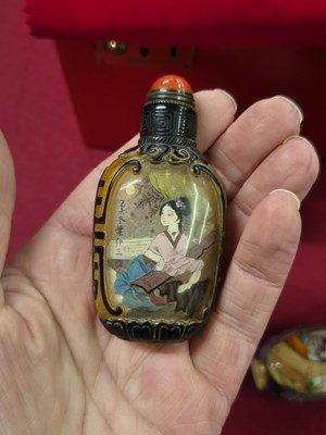 Lot 335 - Three Chinese snuff bottles, one of interior...
