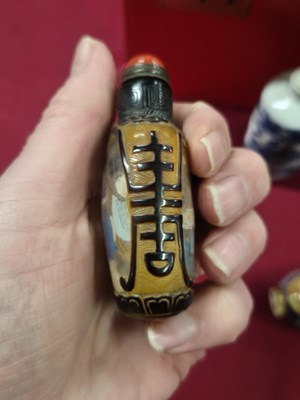 Lot 335 - Three Chinese snuff bottles, one of interior...