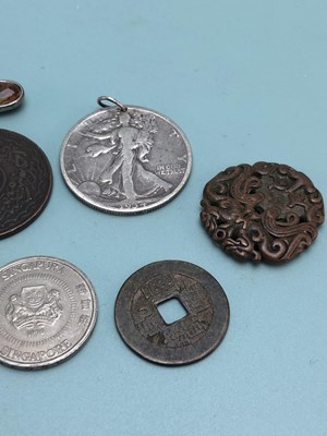 Lot 339 - A 1934 American half dollar pendant, a 1988...