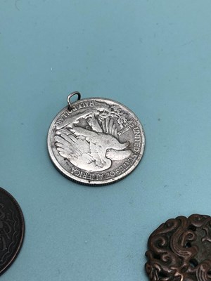 Lot 339 - A 1934 American half dollar pendant, a 1988...