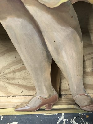 Lot 529 - A painted dummy board of a 1920's lady looking...