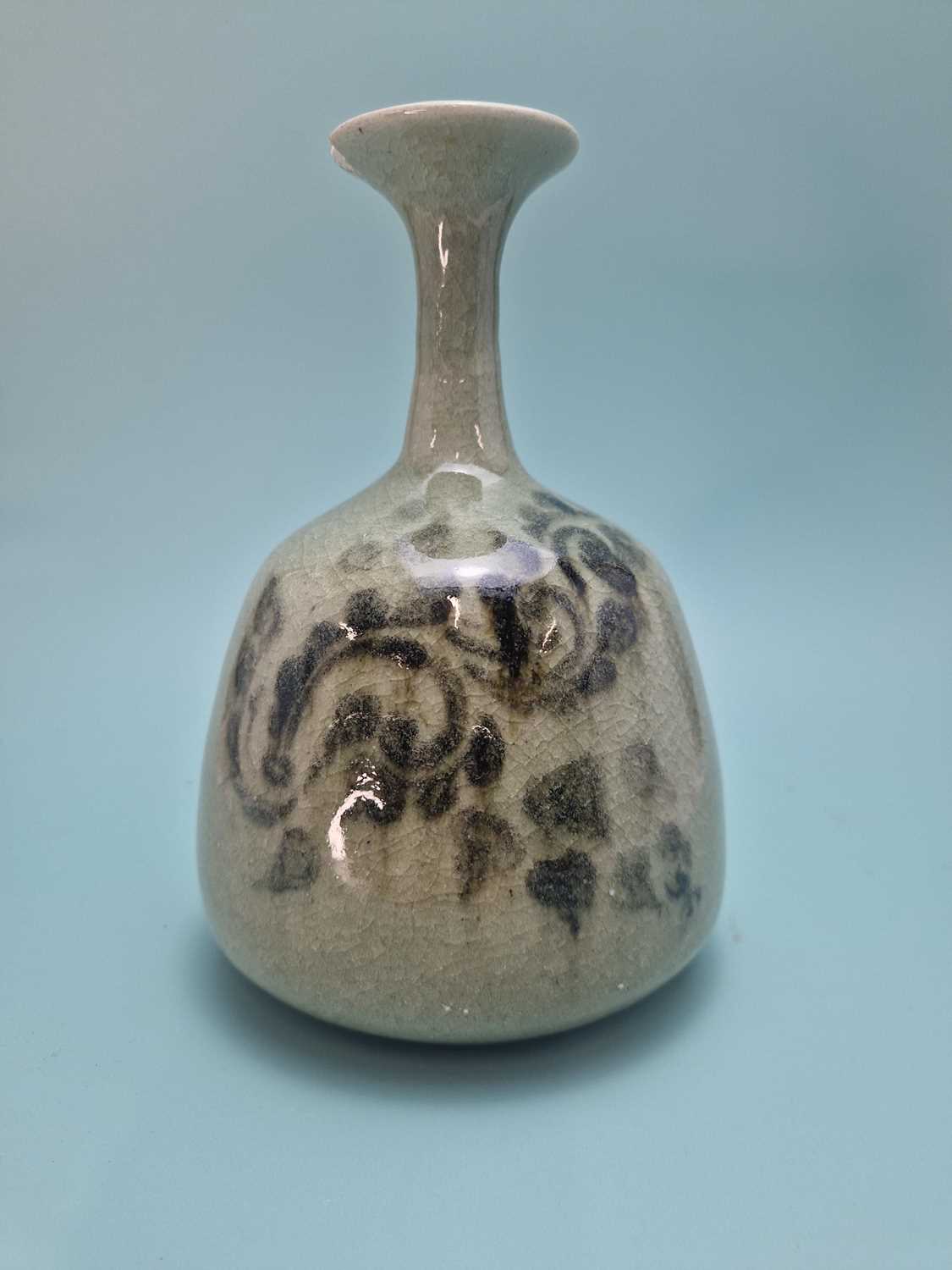 Lot 449 - An unmarked crackled celadon studio bottle...