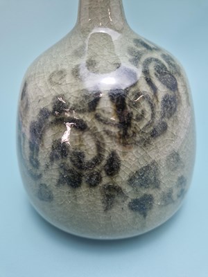 Lot 449 - An unmarked crackled celadon studio bottle...