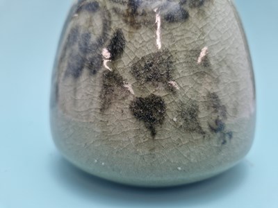 Lot 449 - An unmarked crackled celadon studio bottle...