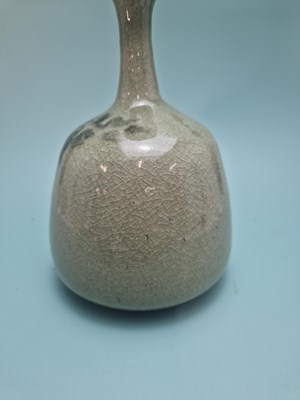 Lot 449 - An unmarked crackled celadon studio bottle...