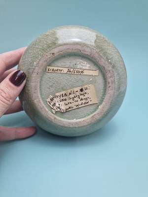 Lot 449 - An unmarked crackled celadon studio bottle...