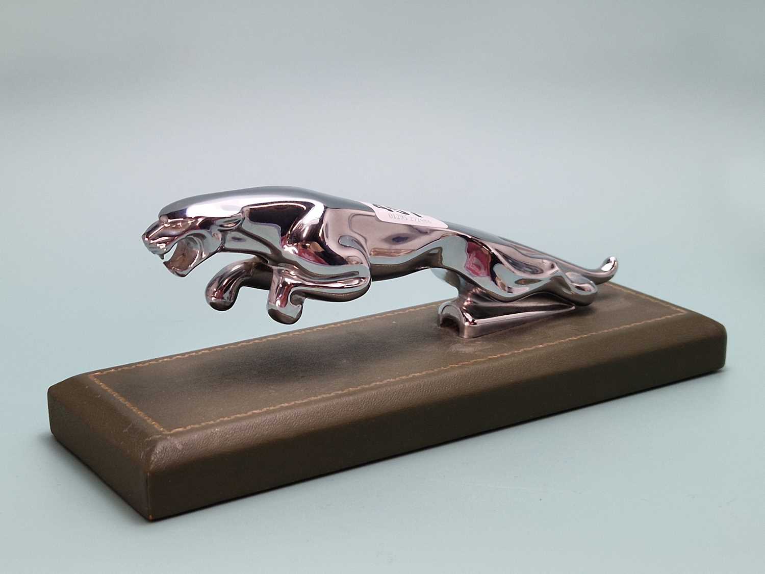 Lot 457 - A chrome desk paperweight in the form of a...