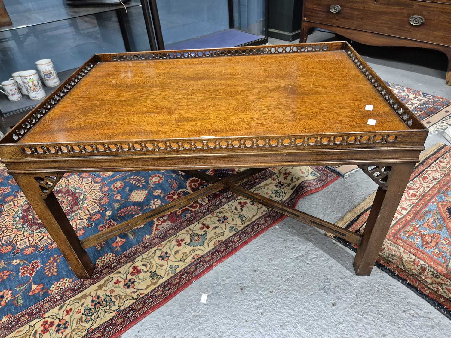 Lot 468 - A mahogany coffee table with a pierced...