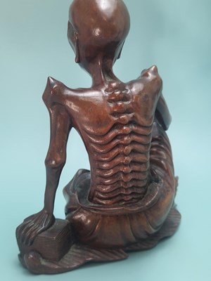 Lot 491 - A Chinese carved wood figure of Liu Hai...