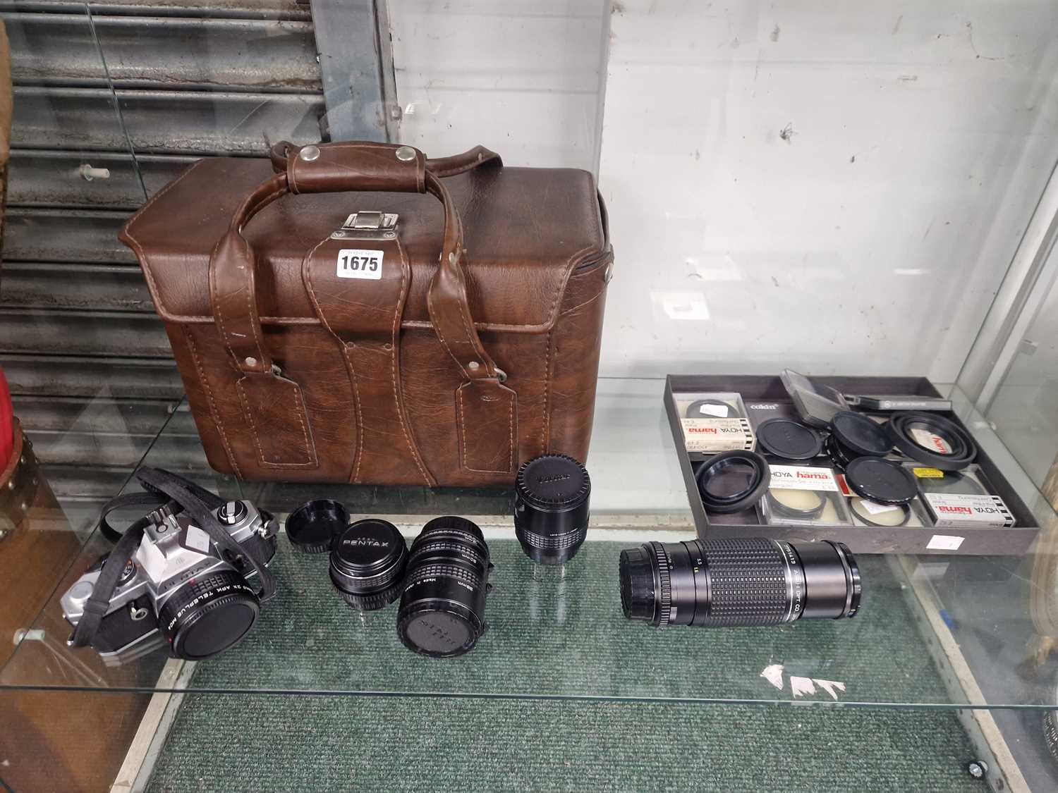 Lot 1675 - A Pentax MX camera, lenses, lens cases...