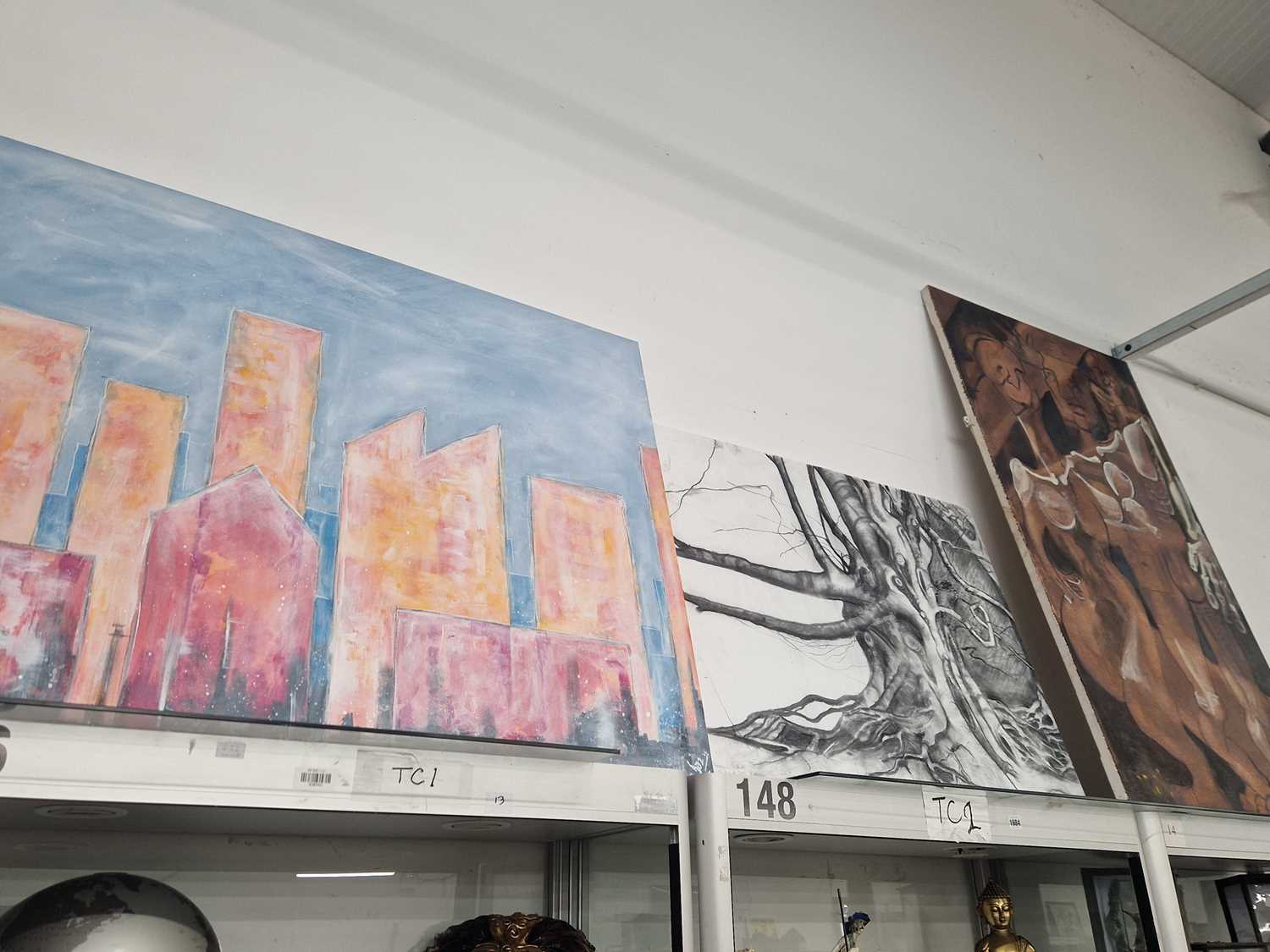 Lot 1684 - Three abstract oil paintings of skyscrapers,...
