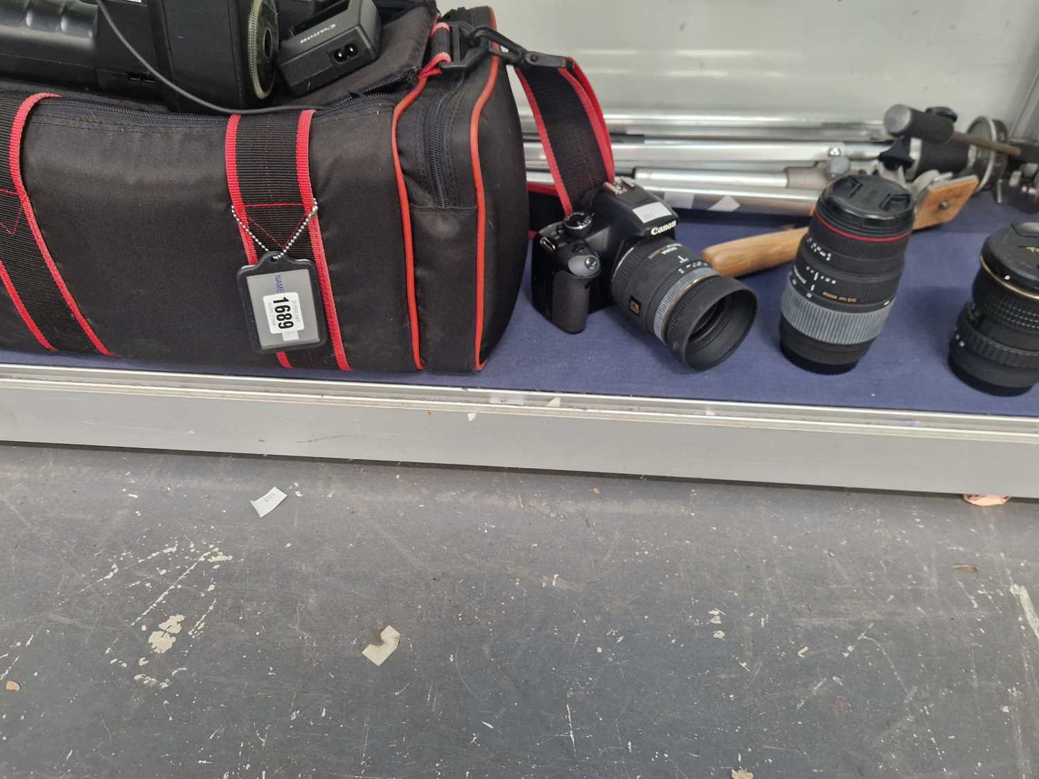 Lot 1689 - A Canon EOS 450D camera, lenses, tripod, flash...