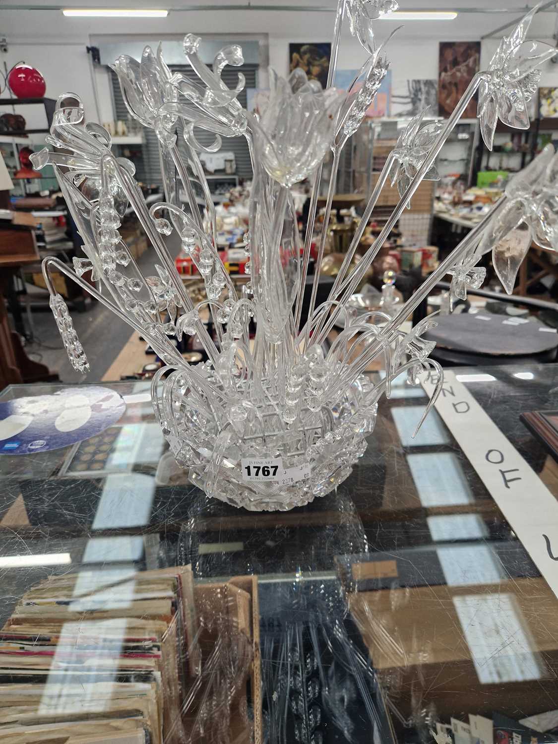 Lot 1767 - A glass bowl of clear glass flowers