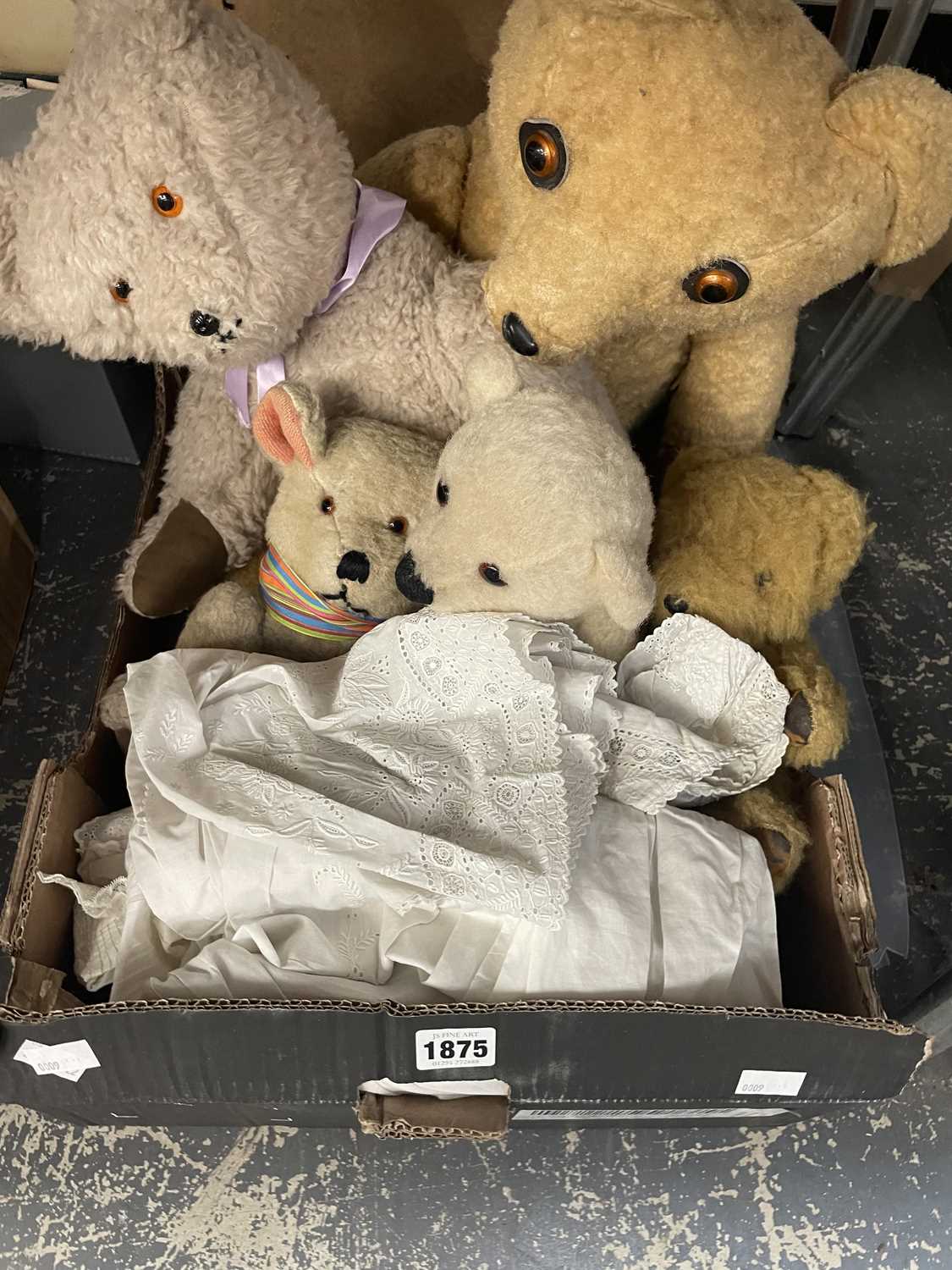 Lot 1875 - Five teddy bears together with christening gowns