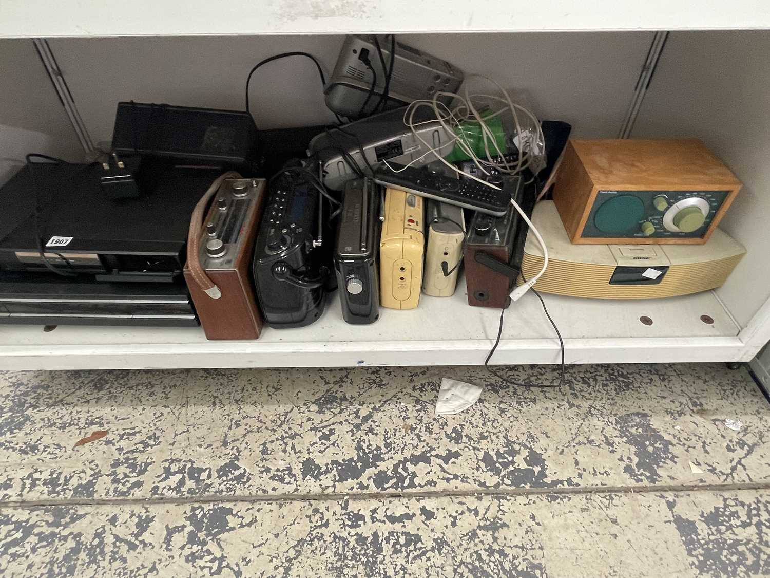 Lot 1907 - A collection of portable radios together with...