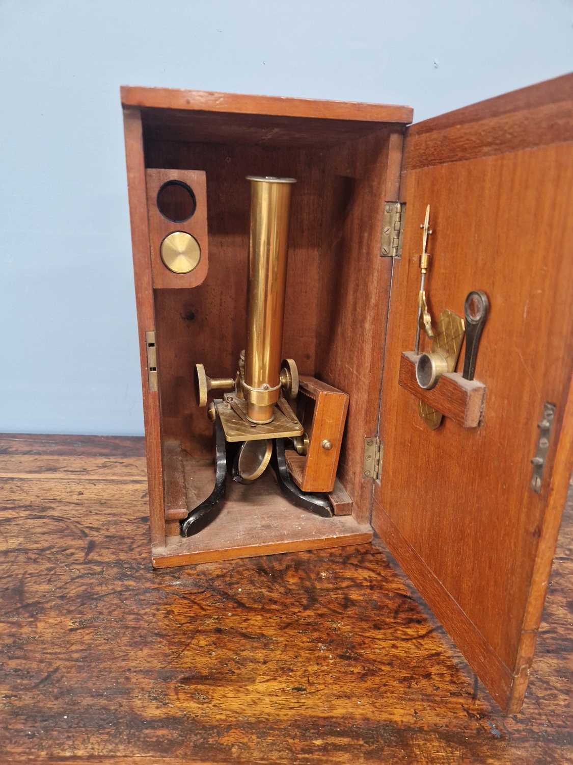 Lot 802 - A mahogany cased brass barreled microscope...