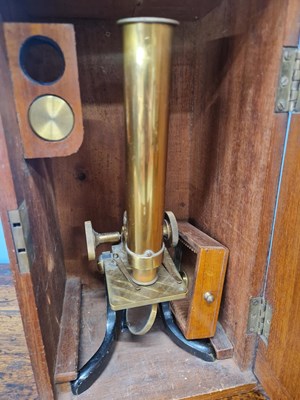 Lot 802 - A mahogany cased brass barreled microscope...