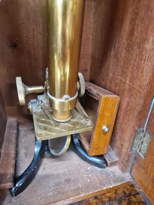 Lot 802 - A mahogany cased brass barreled microscope...