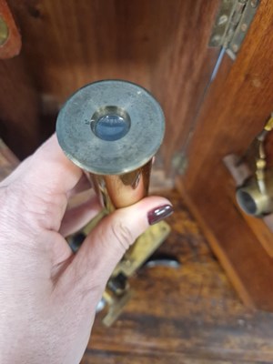 Lot 802 - A mahogany cased brass barreled microscope...