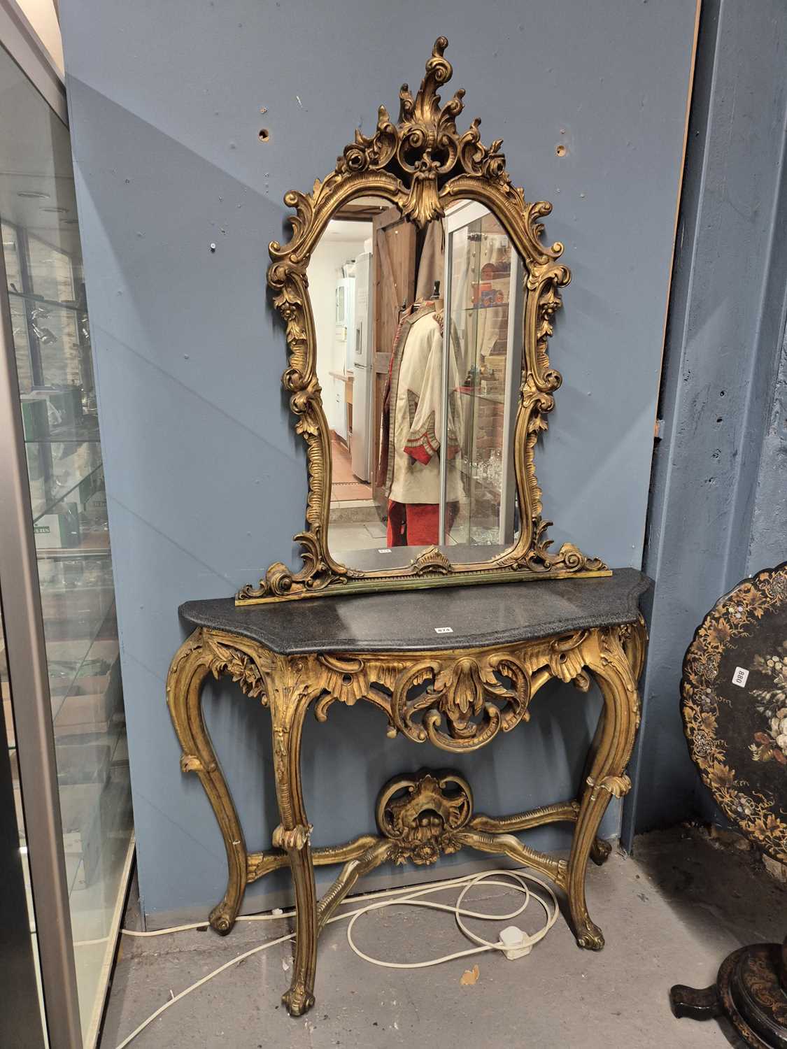 Lot 874 - A gilt gesso pier glass and matching black...