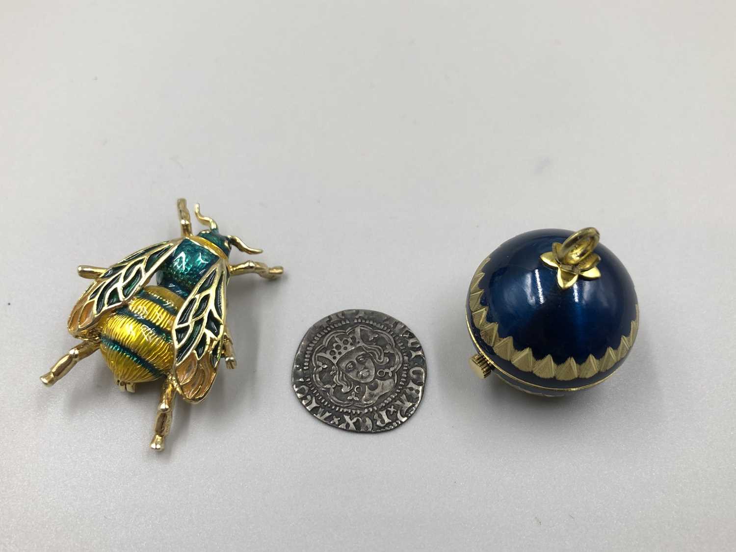 Lot 97 - A Bucherer enamelled ball watch, an insect...