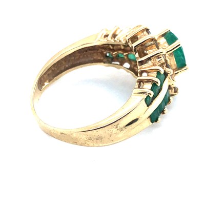 Lot 8 - An emerald and diamond cluster ring with...