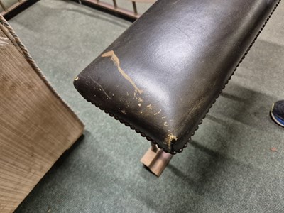 Lot 894 - A green leather seated brass club fender....