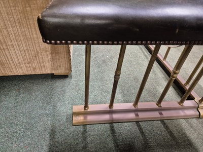 Lot 894 - A green leather seated brass club fender....