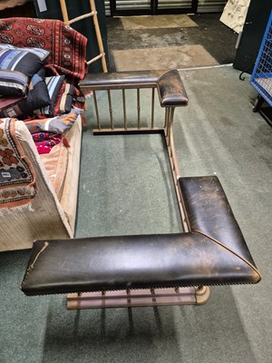 Lot 894 - A green leather seated brass club fender....