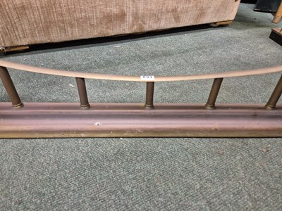 Lot 894 - A green leather seated brass club fender....