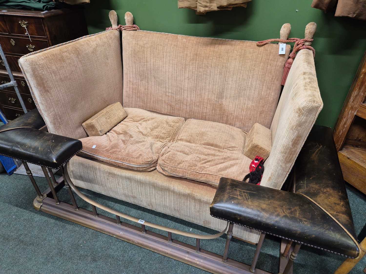 Lot 895 - A two seat knowle settee upholstered in pink...