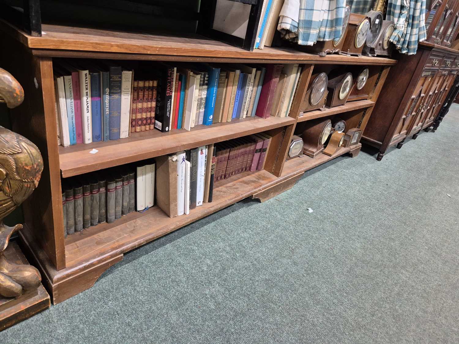 Lot 916 - An open bookcase with two banks of two shelves....