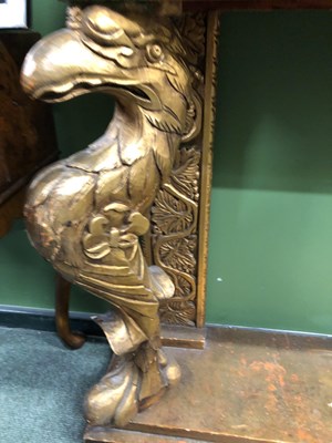 Lot 921 - A mottled pink marble topped console with a...
