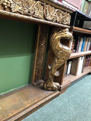 Lot 921 - A mottled pink marble topped console with a...