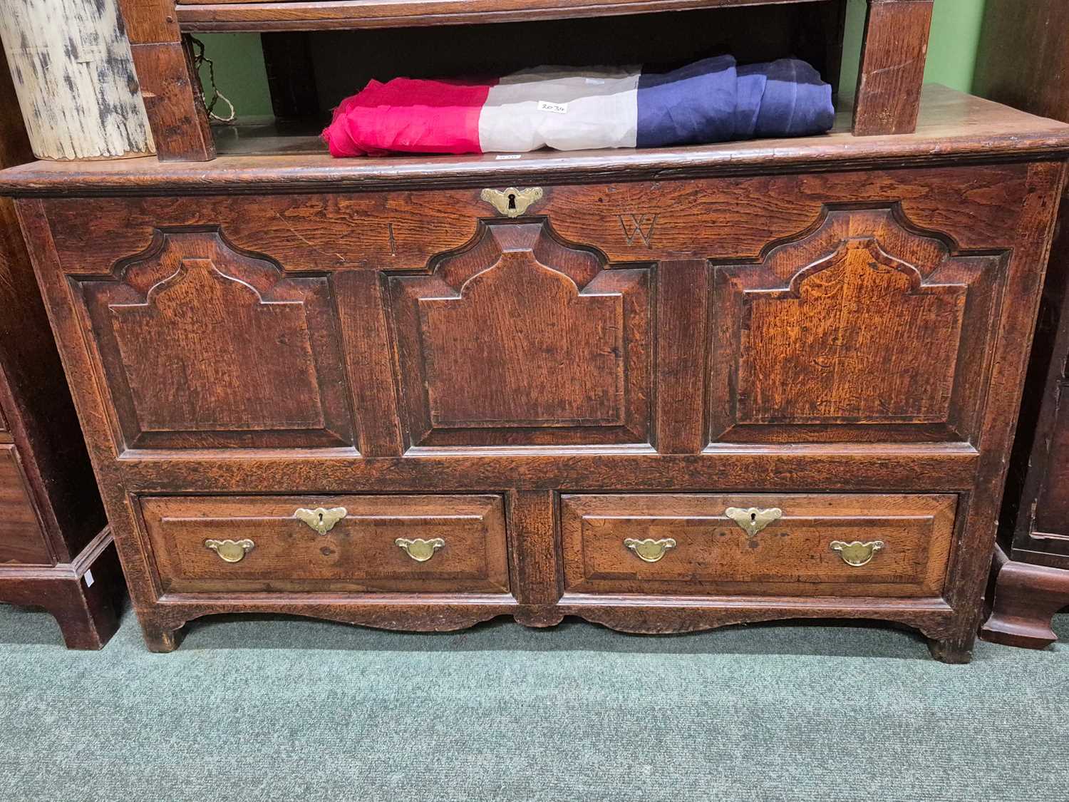 Lot 930 - An 18th century oak mule chest with the three...